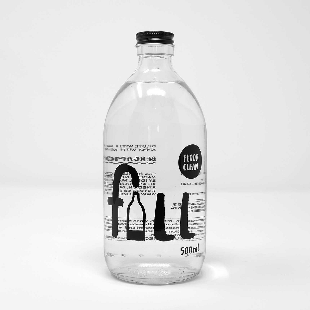 glass bottle of fill co floor clean
