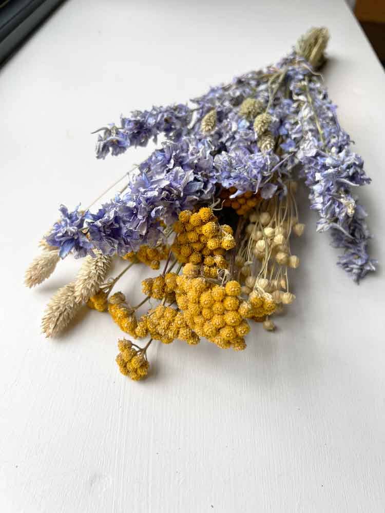 bunch of dried Blue delphinium and yellow iona bunch